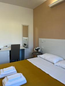 Postel nebo postele na pokoji v ubytování KARIS KAIROS