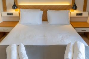 Posteľ alebo postele v izbe v ubytovaní Sirius luxury Boutique