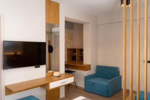 Televízia a/alebo spoločenská miestnosť v ubytovaní Sirius luxury Boutique