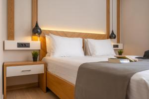 Posteľ alebo postele v izbe v ubytovaní Sirius luxury Boutique