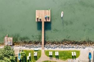 an aerial view of a large crowd of people in the water at Tópart Hotel in Balatonvilágos