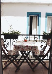 a table and two chairs on a balcony at Mia Butik Hotel Bodrum in Bodrum City