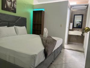 A bed or beds in a room at AW Hotel Vipassa Urban