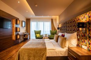 Postel nebo postele na pokoji v ubytování Tópart Hotel