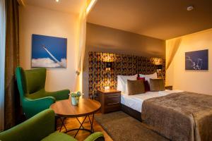 Postel nebo postele na pokoji v ubytování Tópart Hotel
