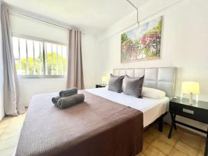 A bed or beds in a room at Apartamentos Zaragoza