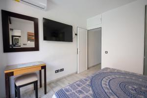 Postel nebo postele na pokoji v ubytování Apartamentos Playa Feliz