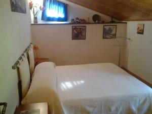 Łóżko lub łóżka w pokoju w obiekcie B&B Casa Villa Siviglia