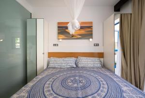 Postel nebo postele na pokoji v ubytování Apartamentos Playa Feliz