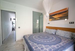 Postel nebo postele na pokoji v ubytování Apartamentos Playa Feliz