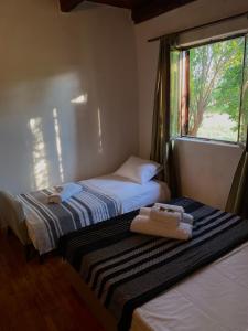 A bed or beds in a room at Casa Madre Kravice Waterfalls