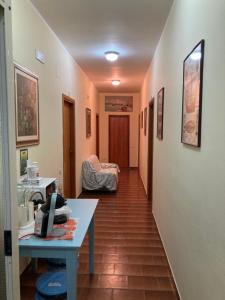 A bed or beds in a room at B&b La Scogliera