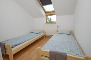 Łóżko lub łóżka w pokoju w obiekcie Apartament Słoneczny 7
