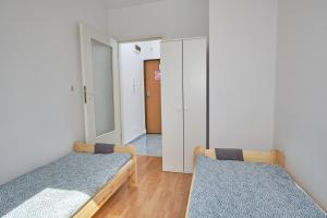 Łóżko lub łóżka w pokoju w obiekcie Apartament Słoneczny 7