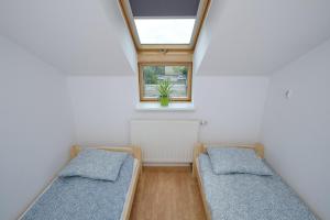 Łóżko lub łóżka w pokoju w obiekcie Apartament Słoneczny 7
