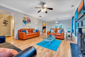 a living room with orange furniture and a fireplace at Atlanta Private Charming Room 2 in Atlanta