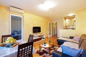 a living room with a couch and a table at Sky City View Apartment & big terrace in Belgrade