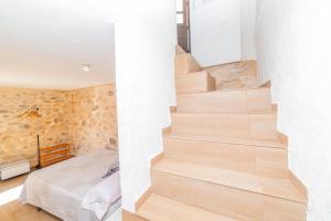 A bed or beds in a room at Casas Rurales Sagasta
