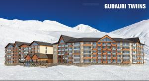 una representación de un gran edificio en la nieve en New Gudauri Twins, en Gudauri