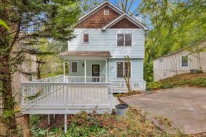 a white house with a porch and a driveway at Atlanta Private Charming Room 2 in Atlanta