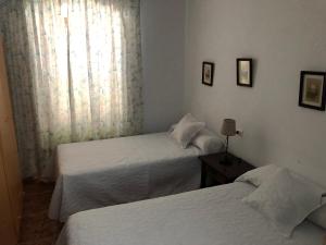 Postel nebo postele na pokoji v ubytování Casa Pepe La Rosa