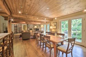 a dining room with a table and chairs at Stunning Warren Lakefront Home Deck, Grill, Sauna in Warren
