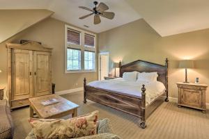 a bedroom with a bed and a ceiling fan at Stunning Warren Lakefront Home Deck, Grill, Sauna in Warren