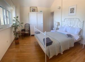 Postel nebo postele na pokoji v ubytování B&B LUCHICHI