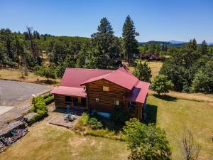 an overhead view of a house with a red roof at Rowland Log Cabin home in Lyle