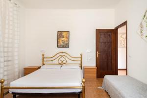 Posteľ alebo postele v izbe v ubytovaní Casa Magrini