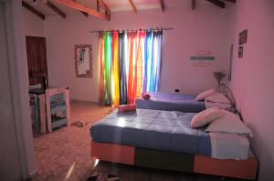 En eller flere senger på et rom på Estudio Los Mosaicos