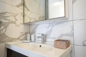 a bathroom with a sink and a mirror at Naz Liman Otel Bodrum in Bodrum City +80 photos