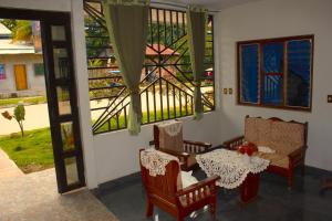 a room with a table and chairs and a window at Hospedaje Eco in Lagunas