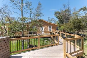 a wooden deck in front of a house at Sea La Vie in Ocean Beach