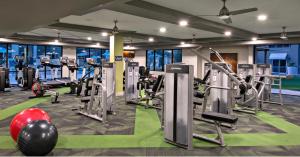 a gym with several treadmills and cardio machines at LUX 2 BED DESERT RIDGE 2 HEATED POOLS GYM in Phoenix