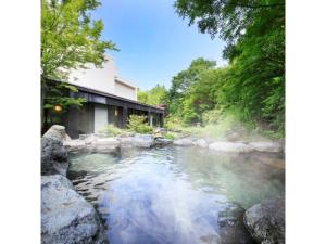 a hot spring next to a house at Kasuga no mori - Vacation STAY 80247v in Saku