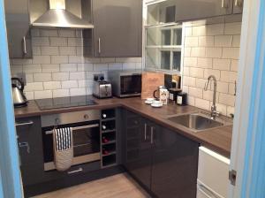 Dapur atau dapur kecil di Coppergate Apartments