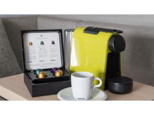 a coffee maker and a cup on a table at Tmark City Hotel Kanazawa - Vacation STAY 90395v in Kanazawa