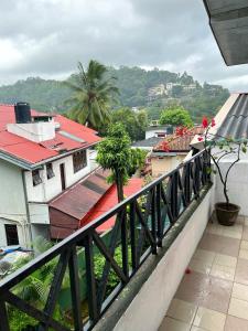 a view of a city from a balcony at Crystal Lake Resort in Kandy