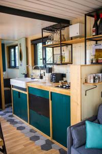 a kitchen with a sink and a counter top at Inspire Tiny in Saint-Laurent +31 photos