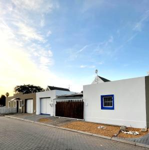 a row of white houses on a street at Self Catering Saldanha House in Saldanha