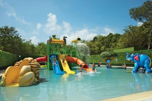 a water park with many different kinds of water slides at Dreams Tulum Resort & Spa in Tulum