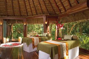 a bedroom with two beds in a room at Dreams Tulum Resort & Spa in Tulum