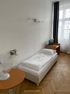 Postel nebo postele na pokoji v ubytování Kolbeck Rooms