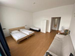 Postel nebo postele na pokoji v ubytování Kolbeck Rooms
