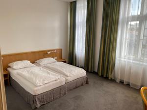 Кровать или кровати в номере Kolbeck Rooms
