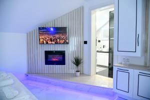 A television and/or entertainment centre at Pansion Eden