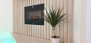 A television and/or entertainment centre at Pansion Eden