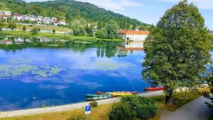 a view of a lake with boats on it at Apartman BELAMAR in Duga Resa