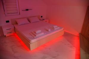 A bed or beds in a room at Pansion Eden